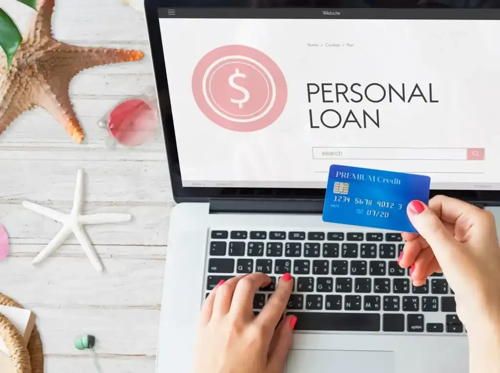Person using a laptop and credit card to compare loan offers online with a Personal Loan Payoff Calculator, evaluating Personal Loan VS Credit Card options, exploring Personal Loans Online Approval, researching Personal Loan Organizations, and looking to Refinance Personal Loan balances.